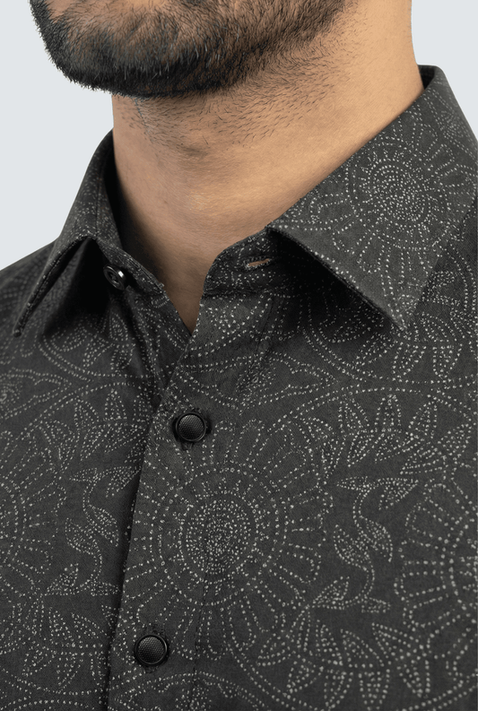 Close-up of black cotton dobby fabric with elegant tonal print texture