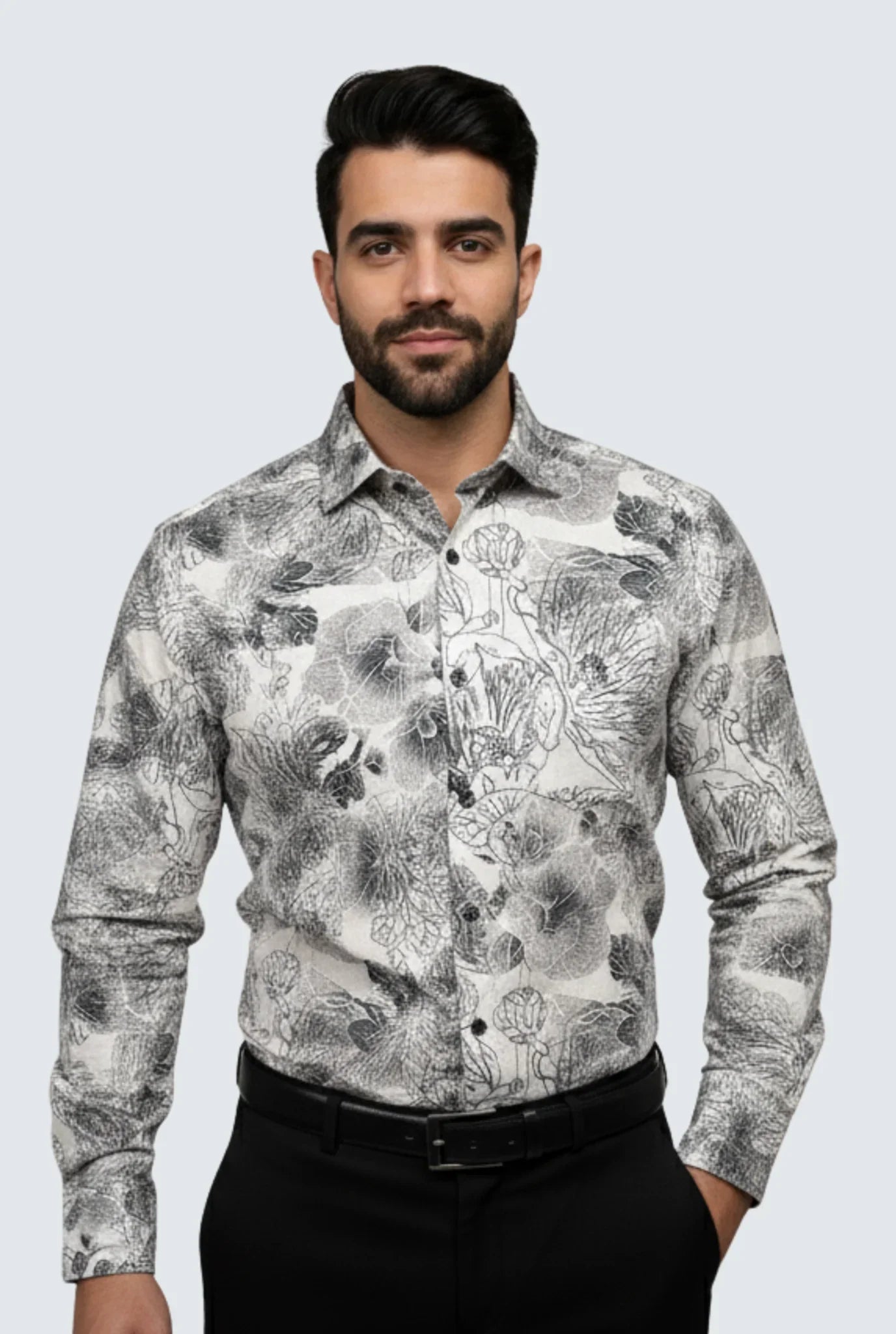 Man wearing stylish black and white floral print long sleeve shirt with black pants