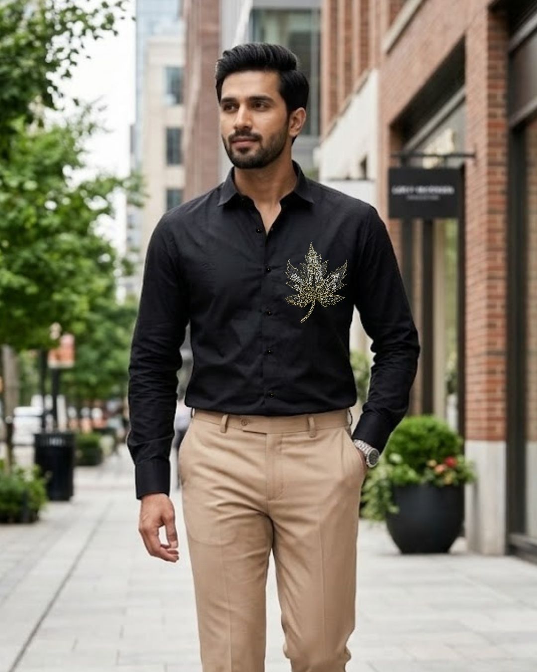 Black satin button-up shirt with long sleeves and chest embroidery