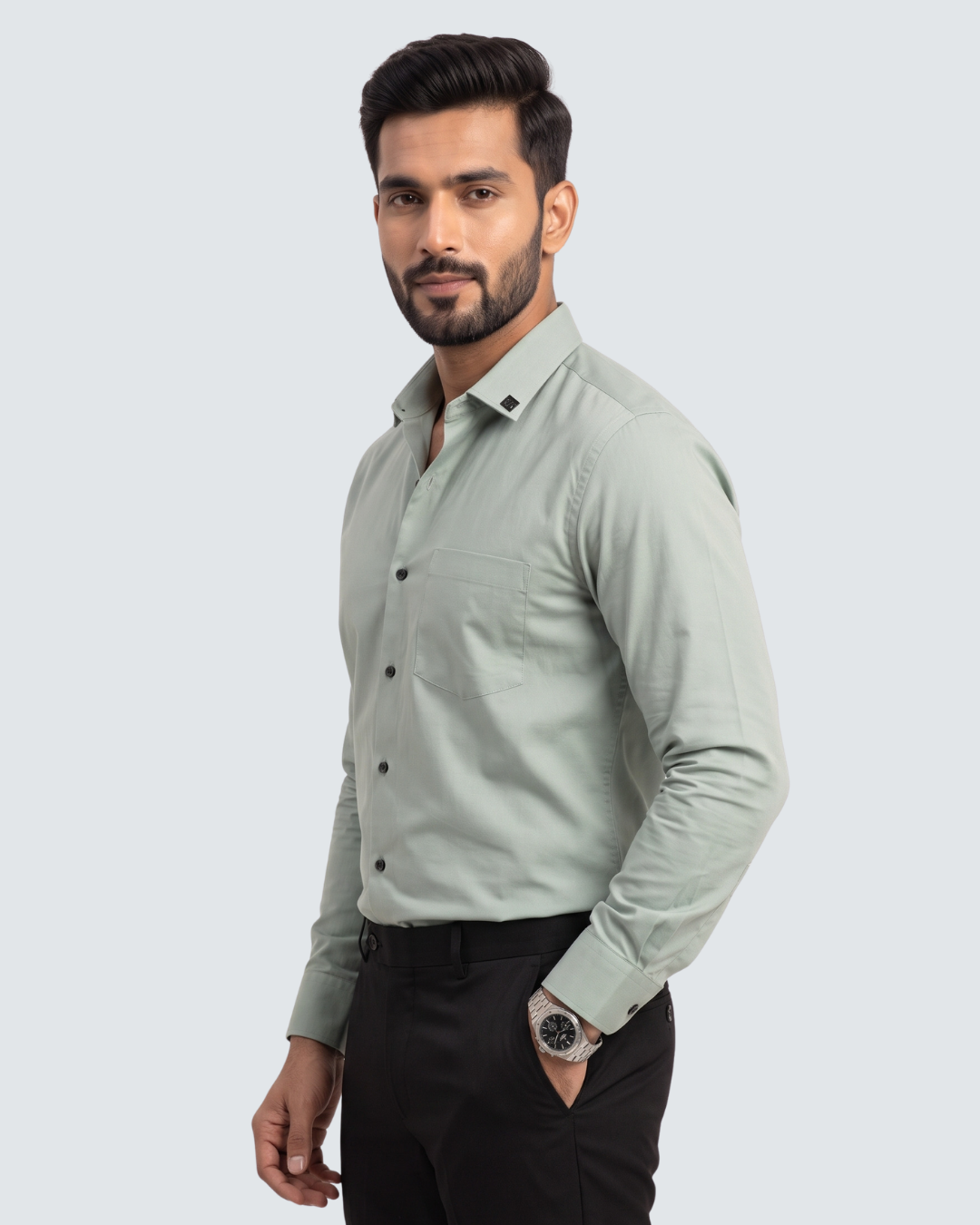 Light green cotton button-up shirt with chest pockets, front view, long sleeves