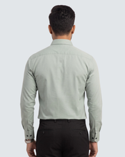 Light green cotton button-up shirt, back view with long sleeves and collar