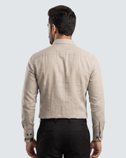 Cream cotton shirt back view, button-up with folded cuffs