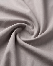 Light grey cotton fabric close-up with soft textured weave