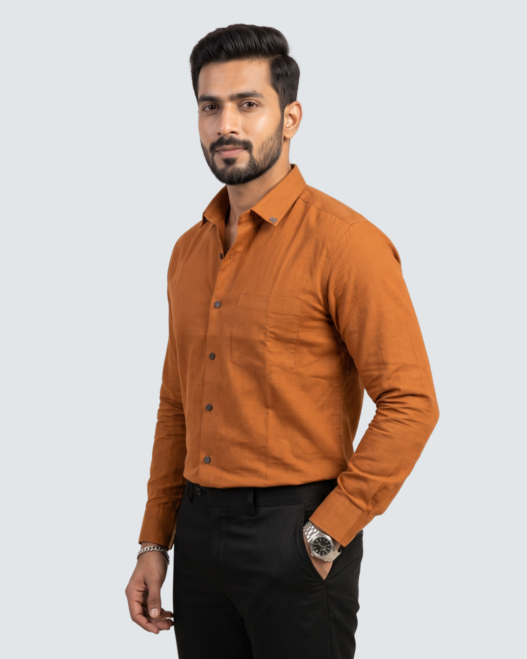 Golden-orange cotton button-down shirt on model, long sleeves and chest pocket