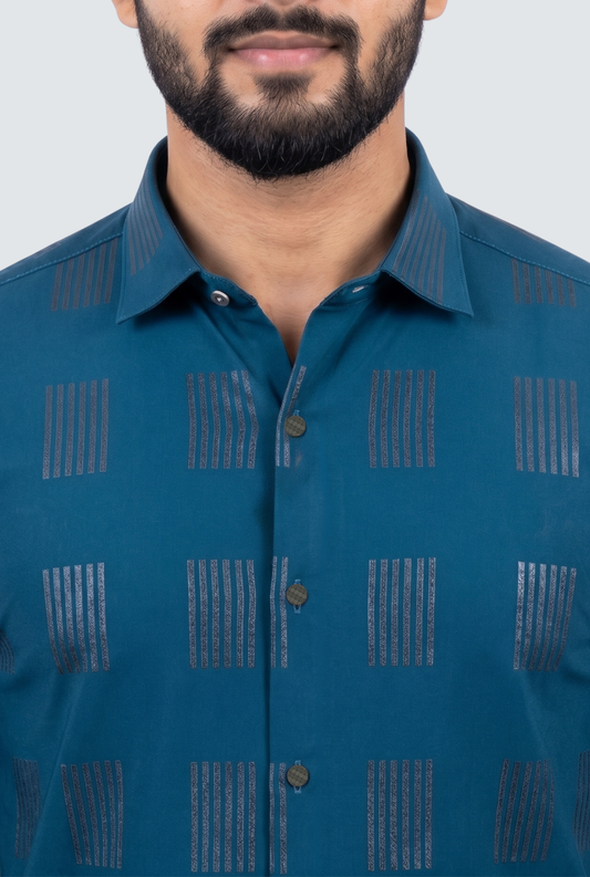 Men's teal blue shirt close-up with geometric stripe pattern and button placket