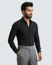 Black long-sleeve button-up shirt, side view with cuff detail