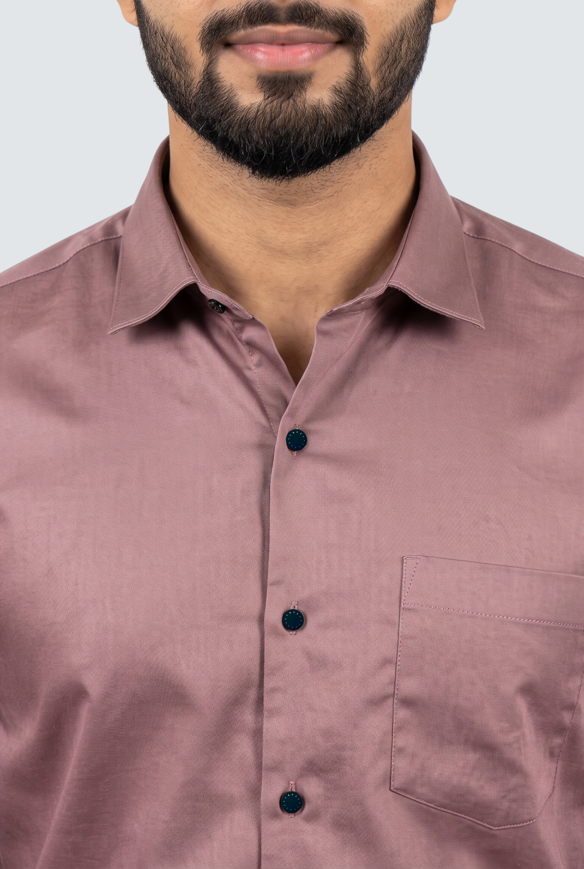 Close-up of dusty mauve button-up shirt collar and front placket with chest pocket