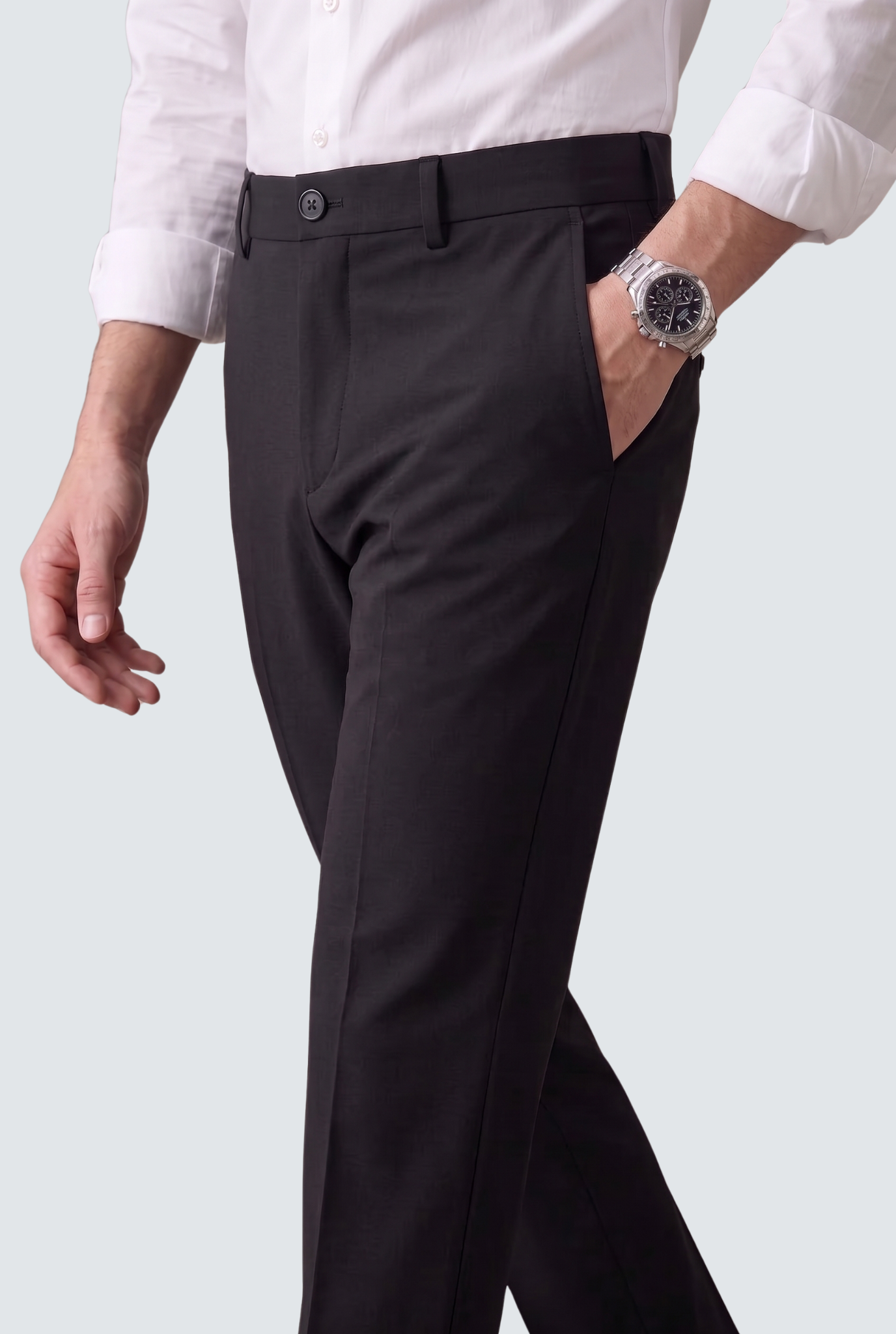 Black slim-fit trousers with slanted side pocket and button waistband
