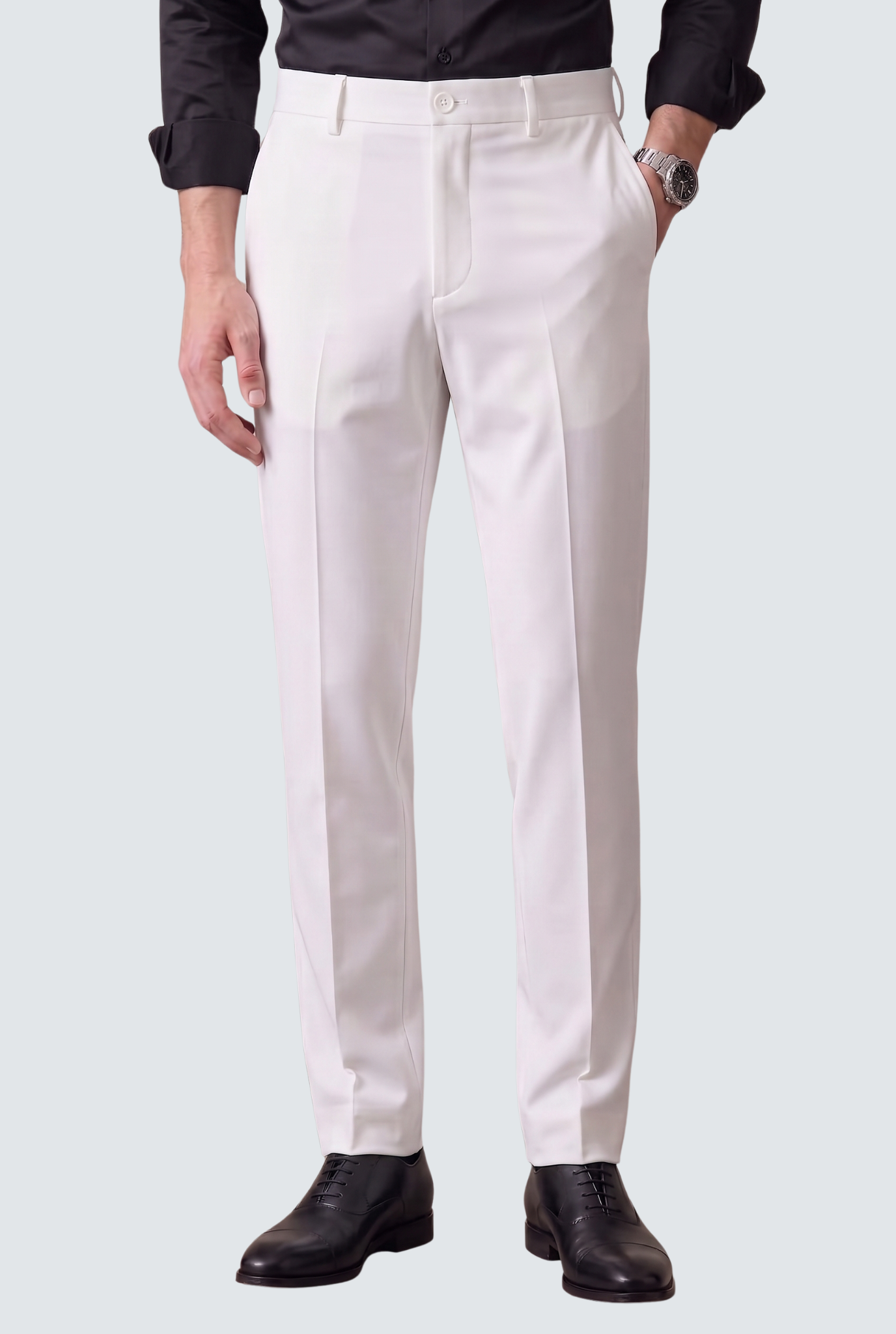 Men's white slim-fit trousers with front creases, belt loops, and button closure