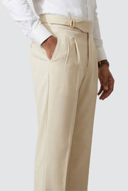 Cream straight-leg trousers with belt, side pocket, and pleated front