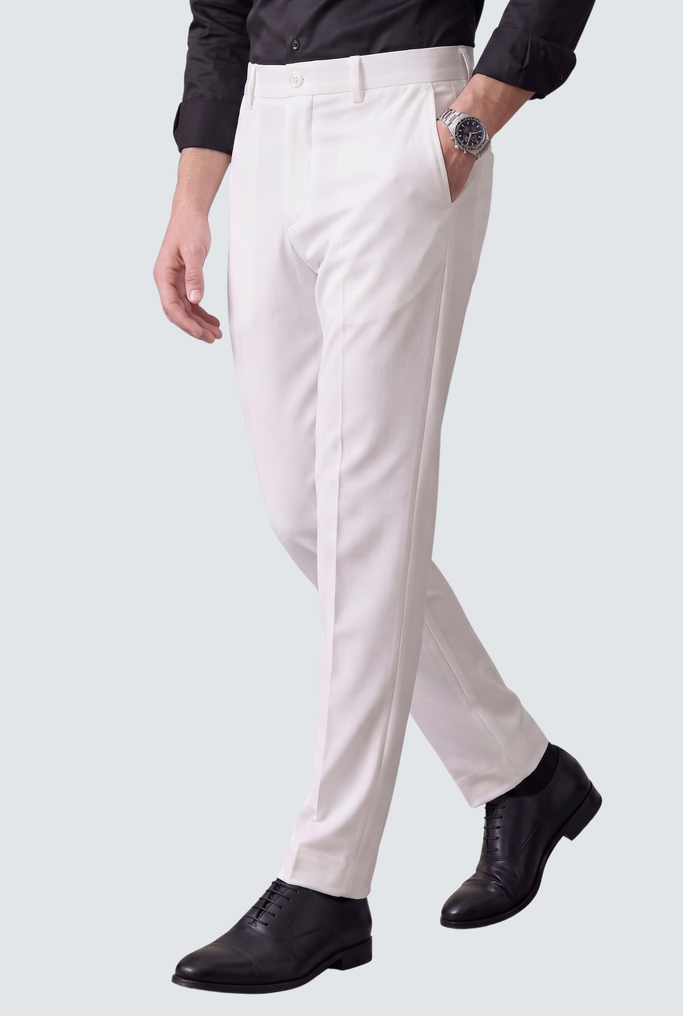Men's white slim-fit trousers, side view with belt loops and flat front
