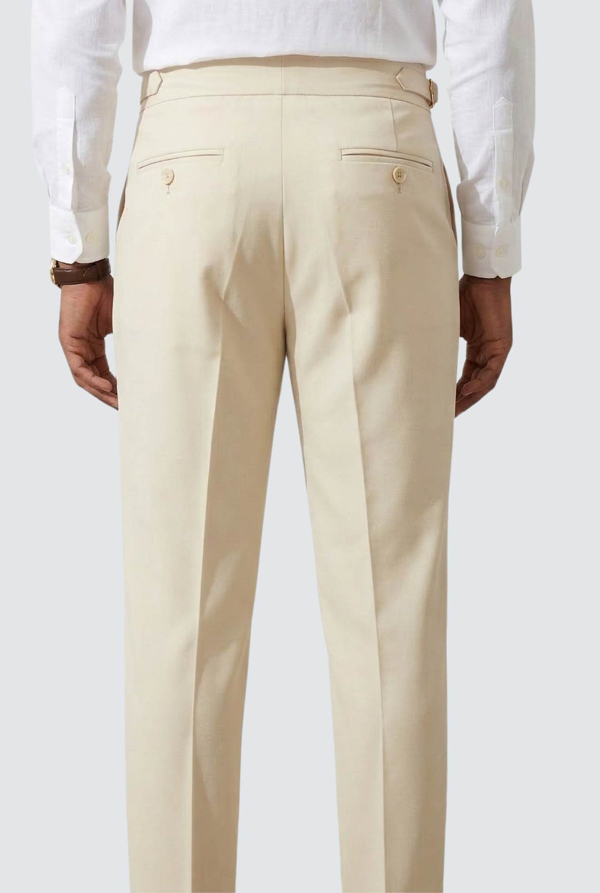 Cream trousers front view with belt loops and button back pockets