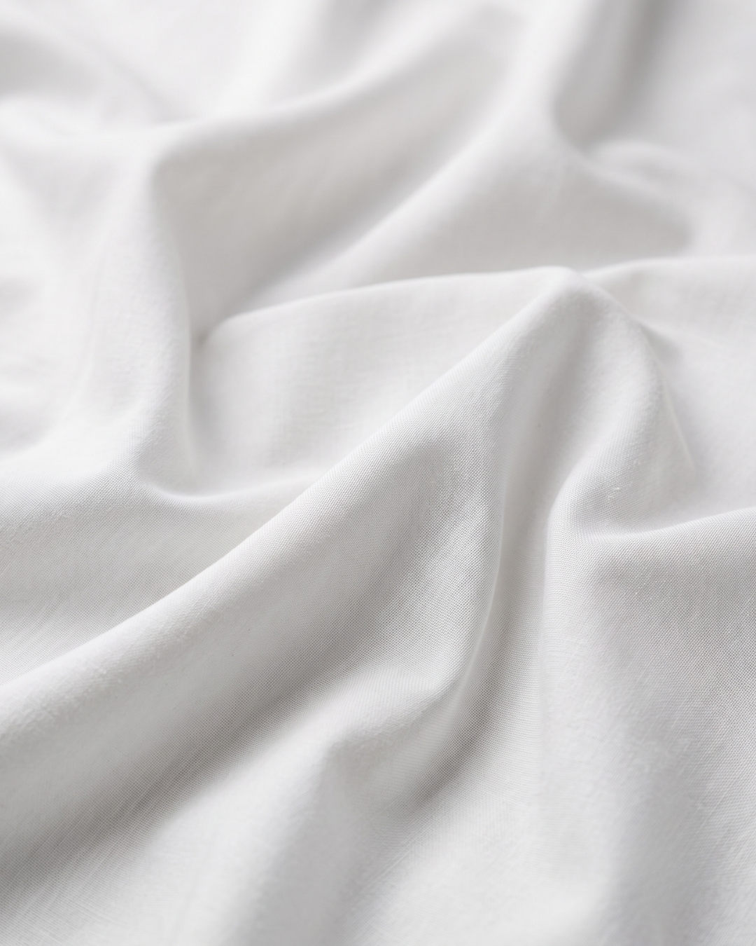 White cotton shirt fabric with smooth woven texture