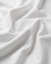 White cotton shirt fabric with smooth woven texture