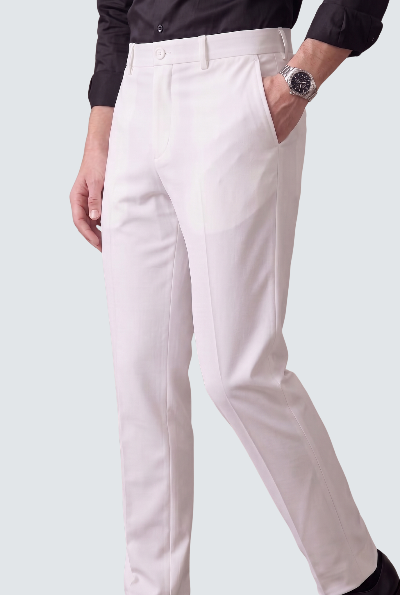 Men's white slim-fit trousers, angled view with belt loops and crease details