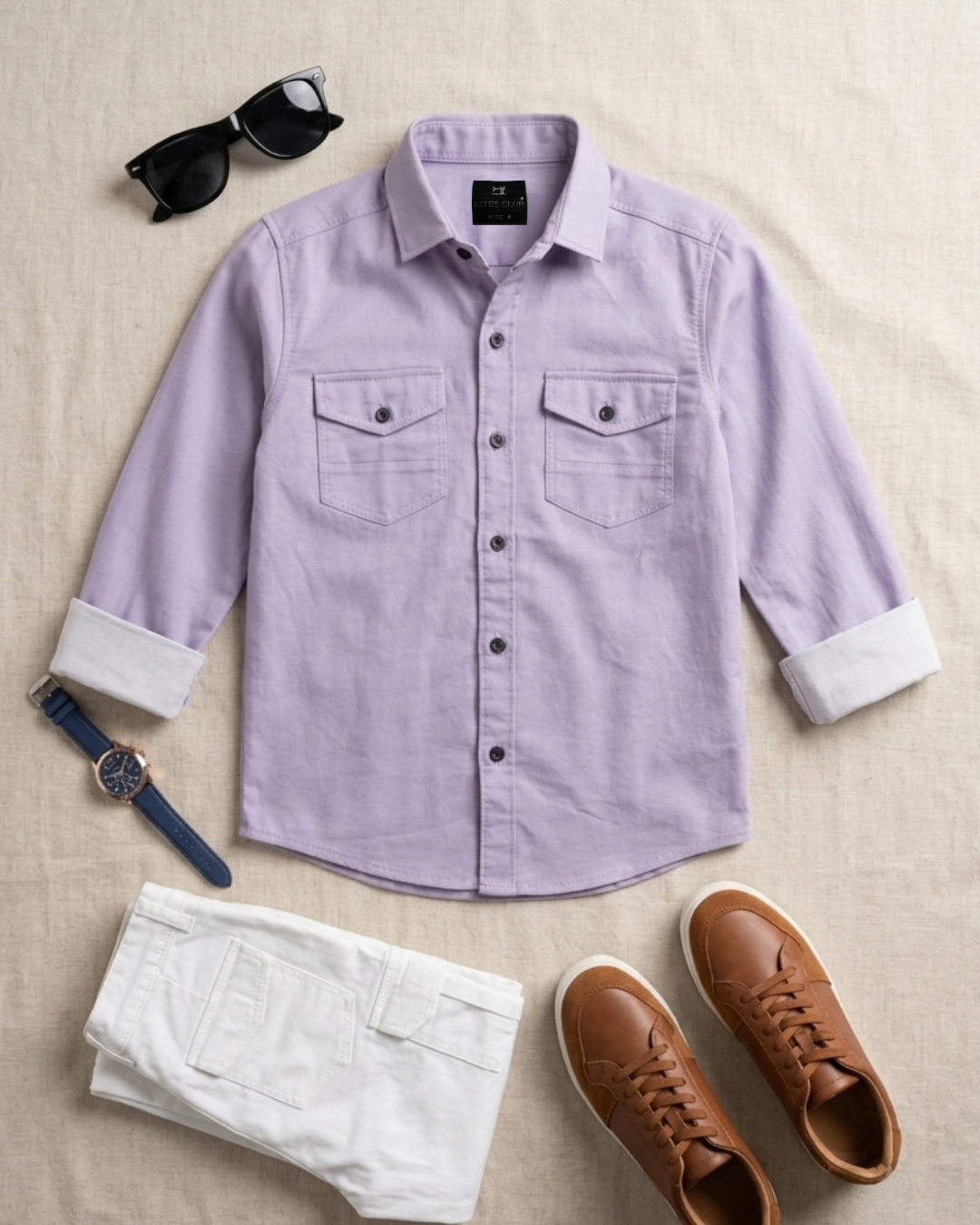 Lavender boys short-sleeve button-up shirt laid flat, two chest pockets