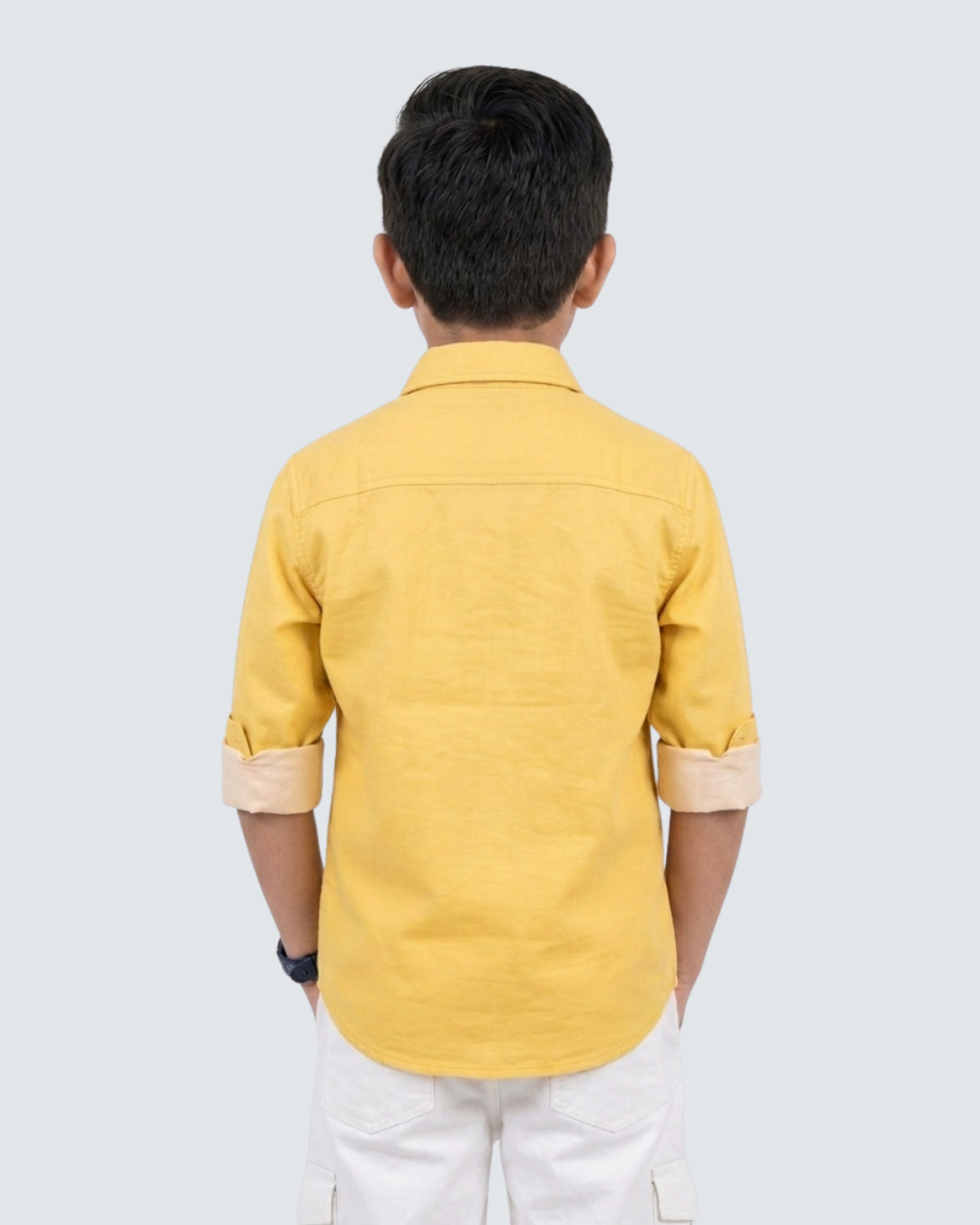 Back view of boys yellow cotton button-up shirt with collar and sleeves