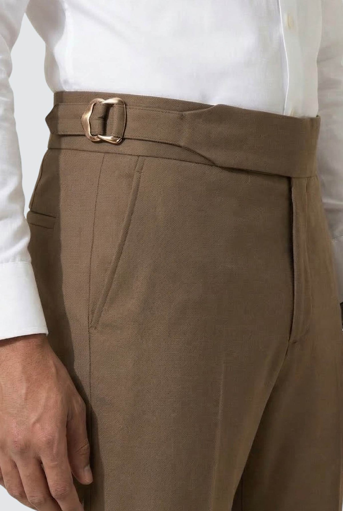 Men's brown trousers with fabric belt and metal buckle at waist