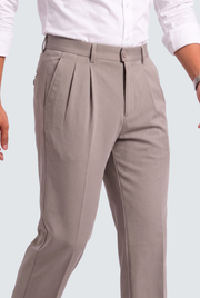 Light gray tailored trousers with pleated front, belt loops, and side pockets