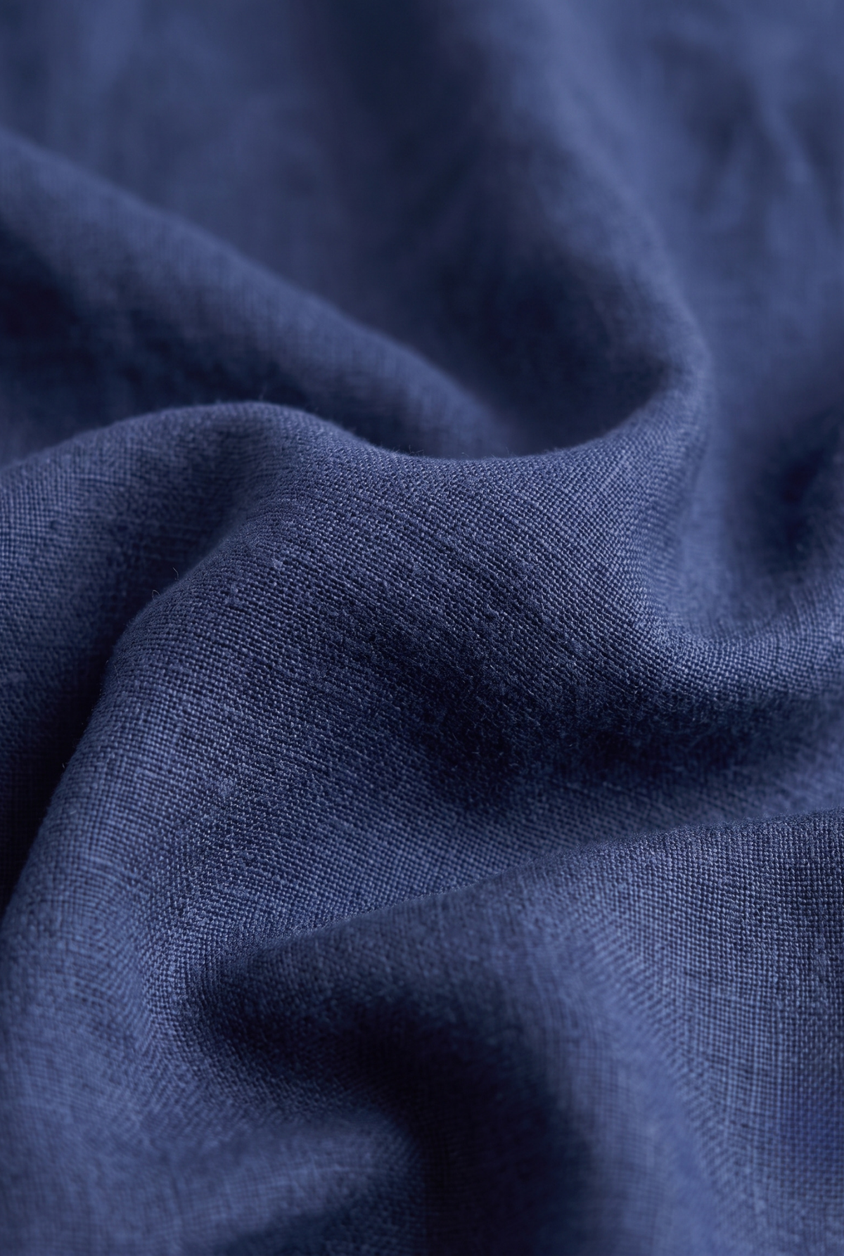 Navy linen fabric close-up with visible woven texture