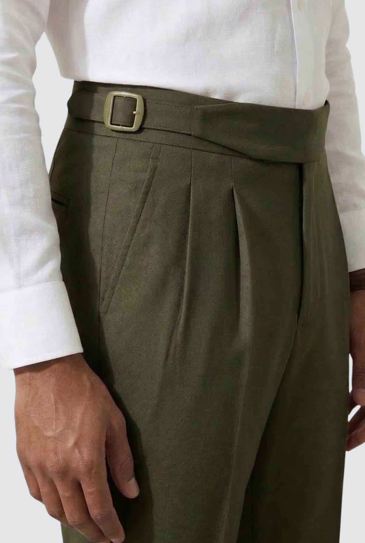 Bottle green men’s trouser waist with belt buckle and pleated front