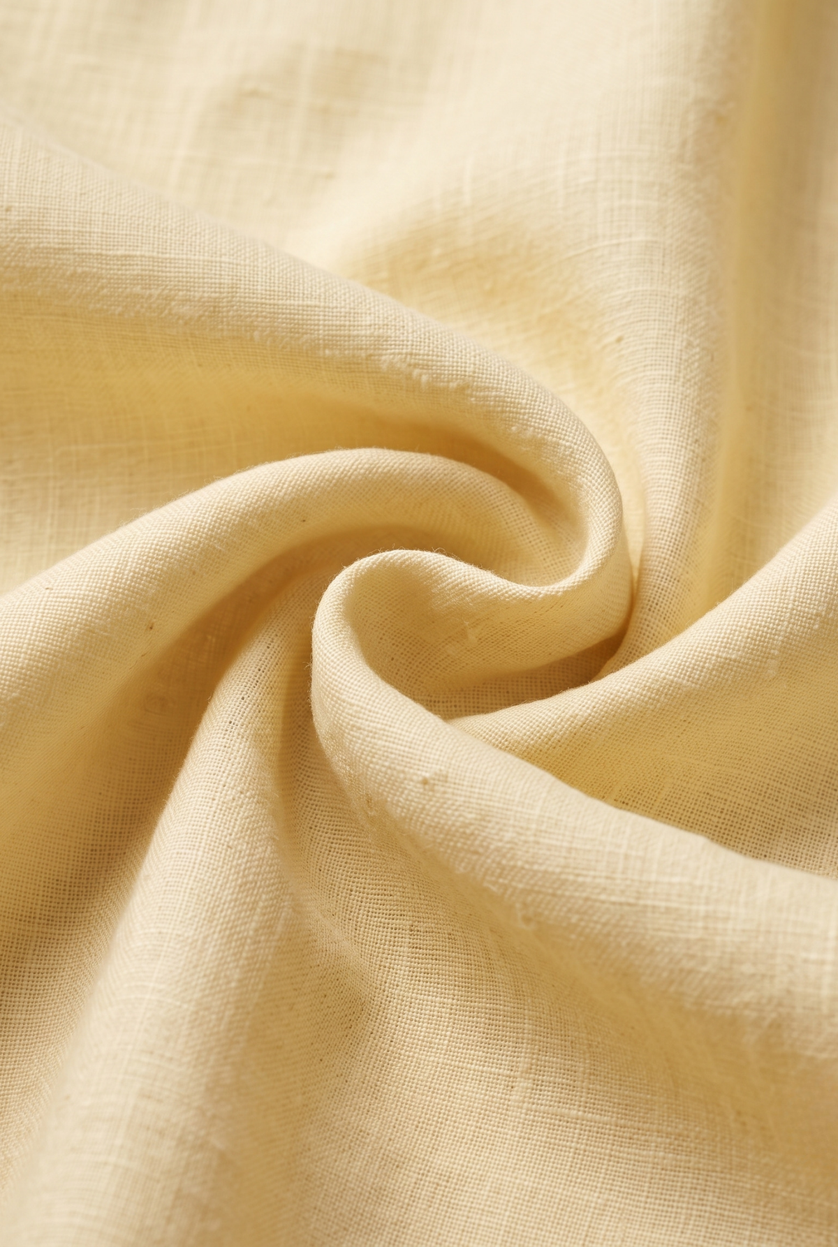 Lemon yellow linen fabric close-up with visible weave texture