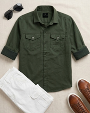Green cotton boys button-up shirt with collar and twin chest pockets