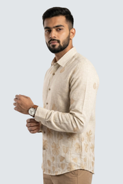 Cream linen shirt with floral leaf pattern, button front, and long sleeves.