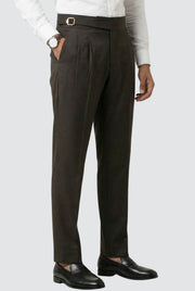 Men's brown pleated trousers with belt loops and tapered legs, side pockets.