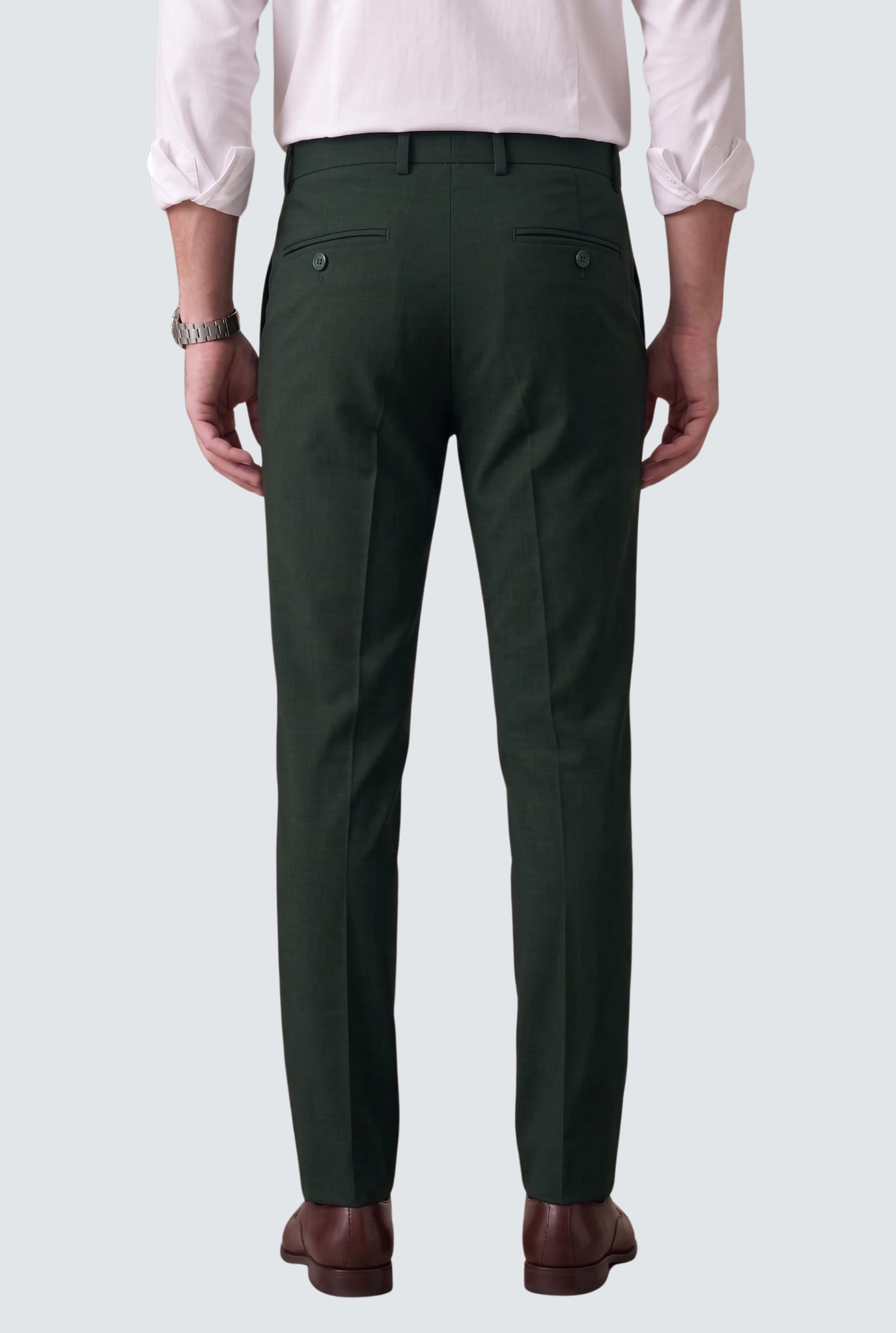 Bottle green slim-fit regular trousers, rear view with belt loops and button waist.