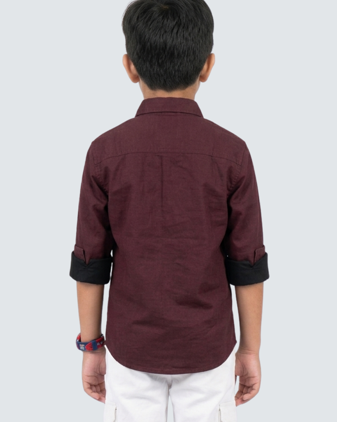 Maroon boys cotton button-up shirt, back view with dark cuffed sleeves.