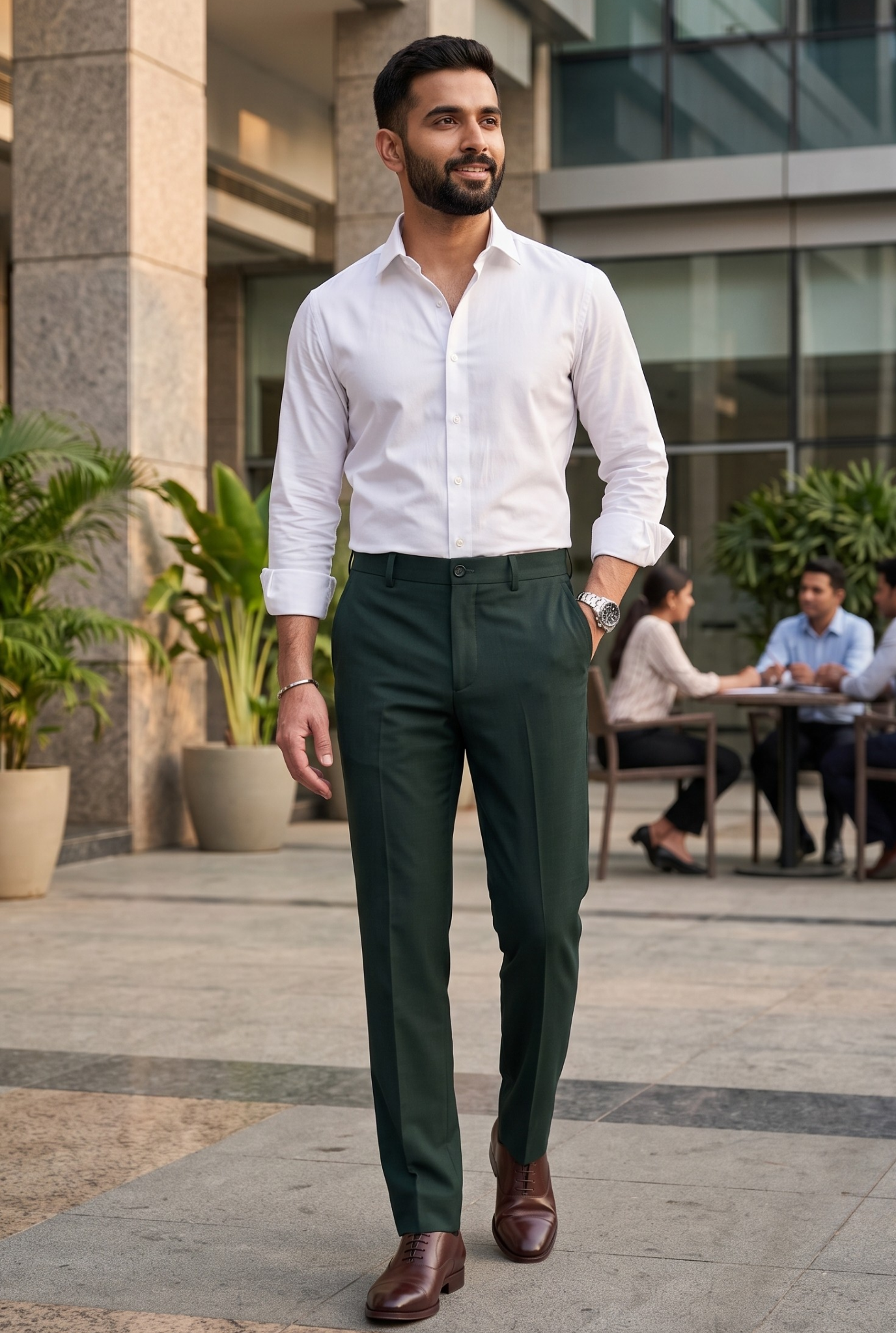 Bottle green slim-fit regular trousers worn by model: button waist, belt loops, tapered fit.