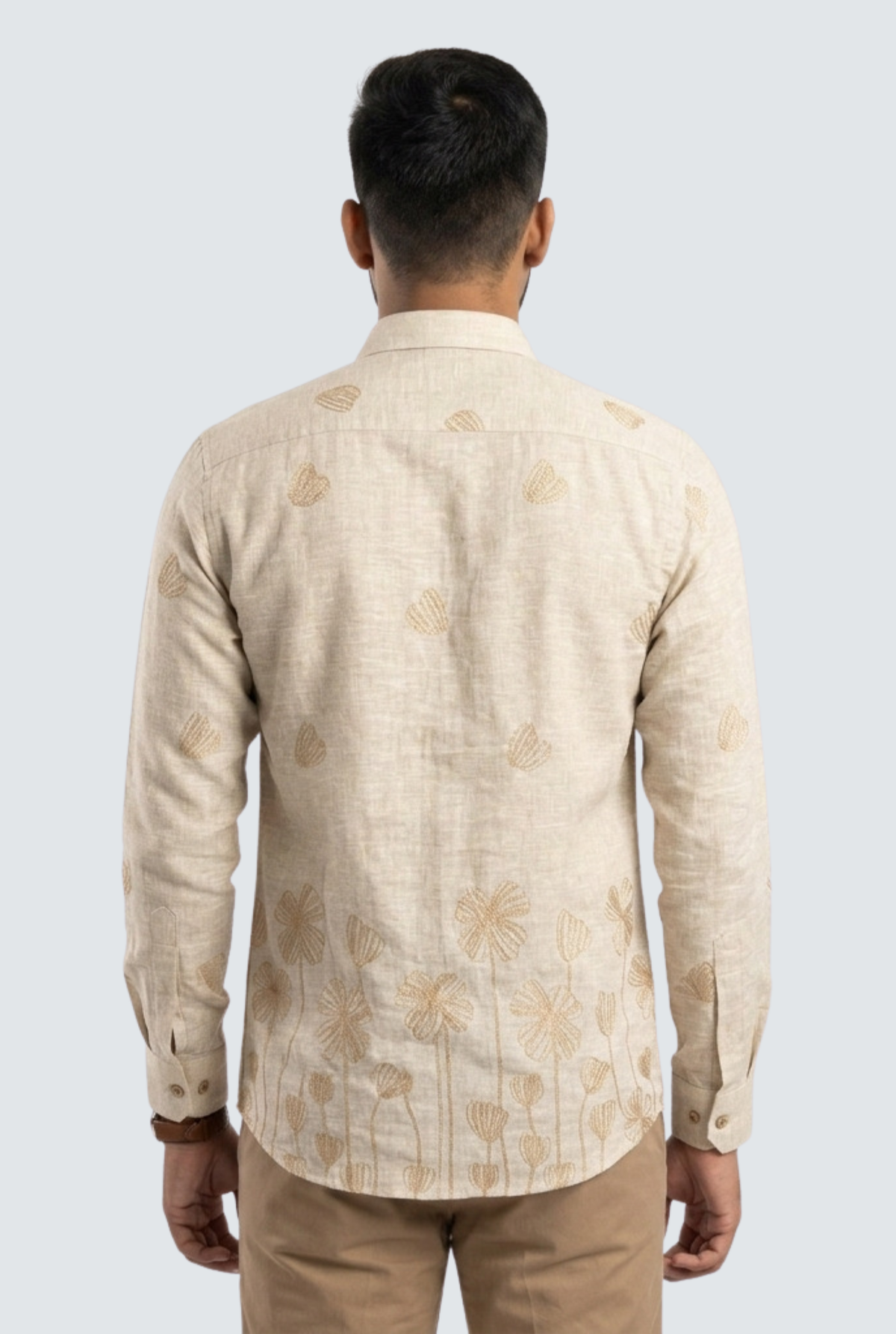 Cream linen back view shirt with allover floral leaf pattern and long sleeves.