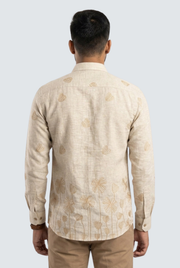 Cream linen back view shirt with allover floral leaf pattern and long sleeves.