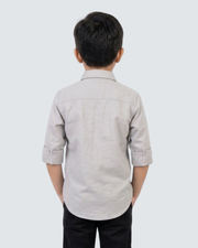 Boys' grey cotton button-up shirt, back view with yoke and folded sleeves