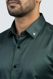 Men's dark green glossy satin dress shirt, pointed collar and button close-up