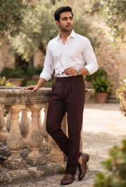 Men's dark purple straight-fit Gurkha trousers worn with a white shirt, pleated front