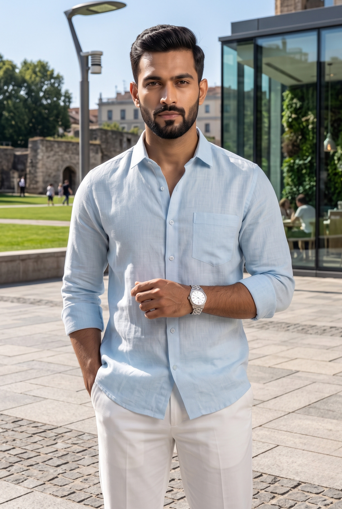 Sky blue linen button-up shirt with chest pocket, front view on model