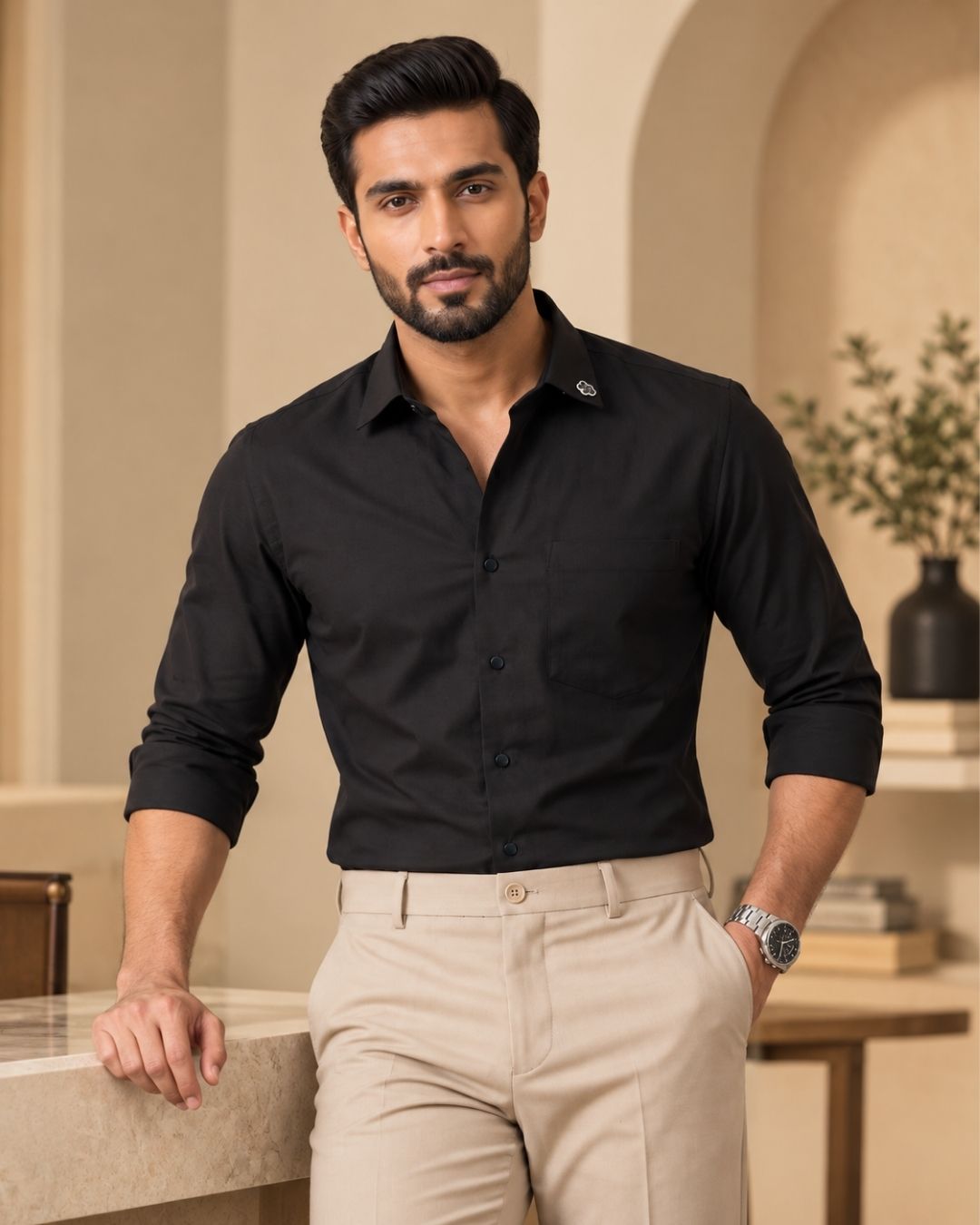 Black cotton button-up shirt with long sleeves and spread collar