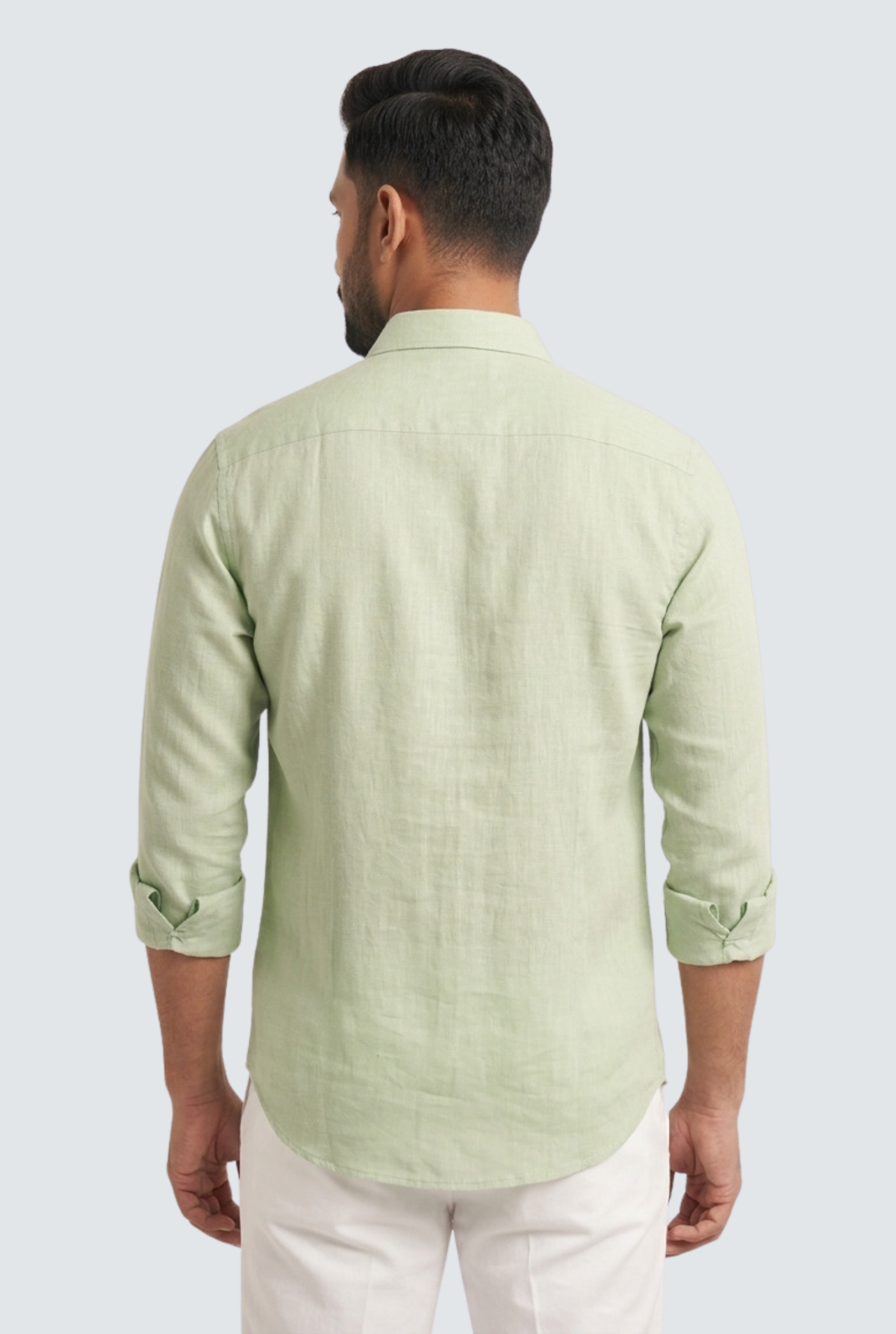 Light green linen button-up shirt, back view, long sleeves and curved hem