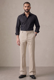 Fawn bootcut trousers with belt loops, button waist, and front crease