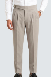 Light grey men's pleated trousers with belt, zip fly and tapered legs