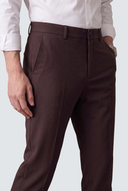 Men's dark purple slim-fit trousers close-up of button waistband and front seam
