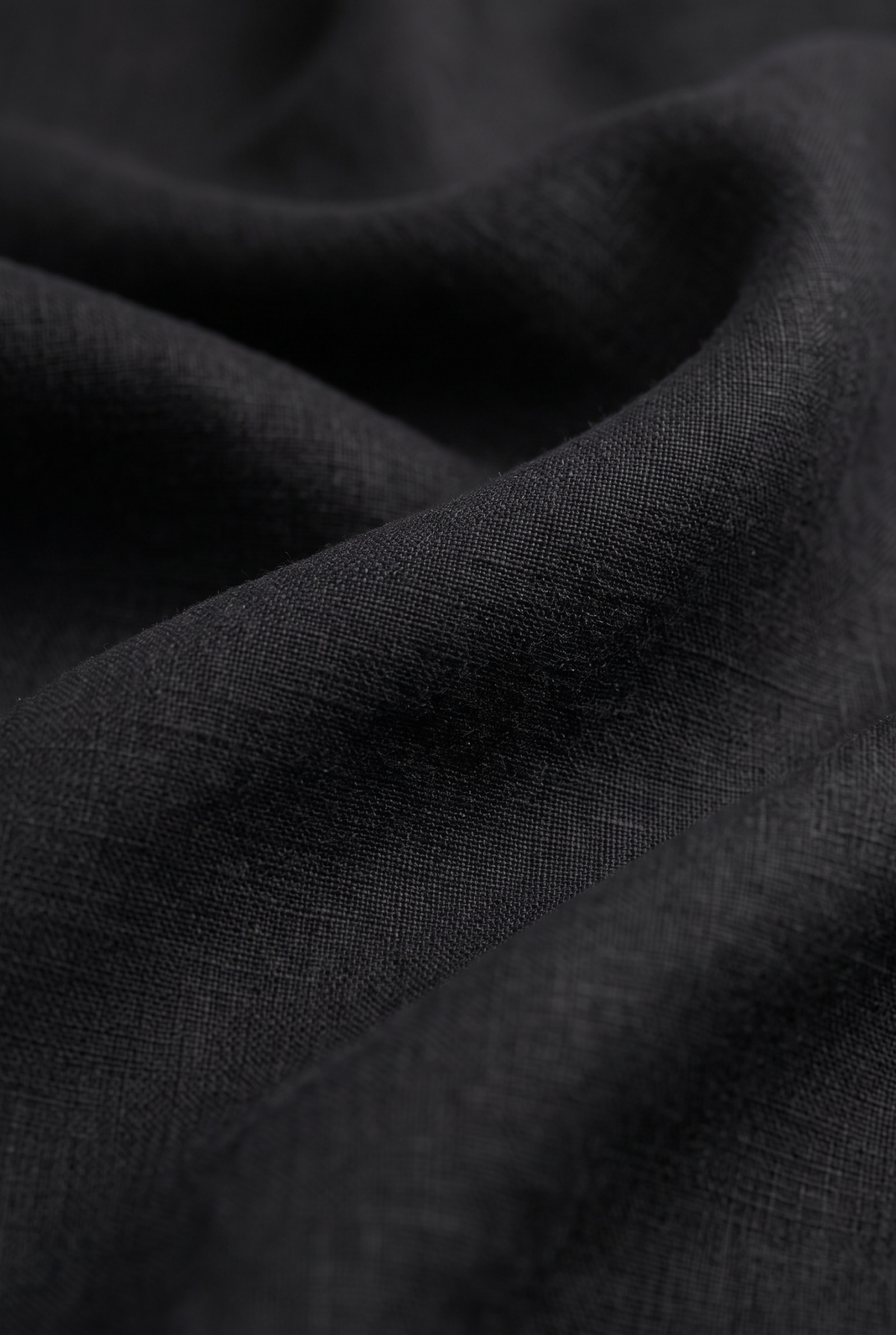 Black linen fabric close-up with woven texture