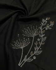 Close-up of black satin lycra shirt with gold floral and leaf embroidery pattern