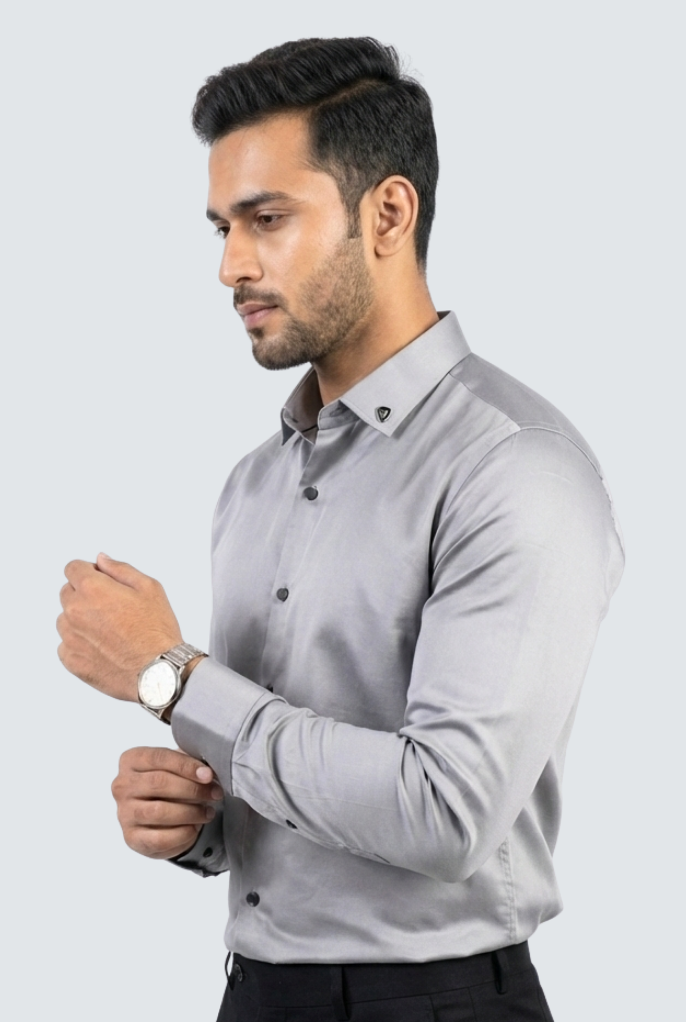 Man wearing a gray dress shirt on a light gray background