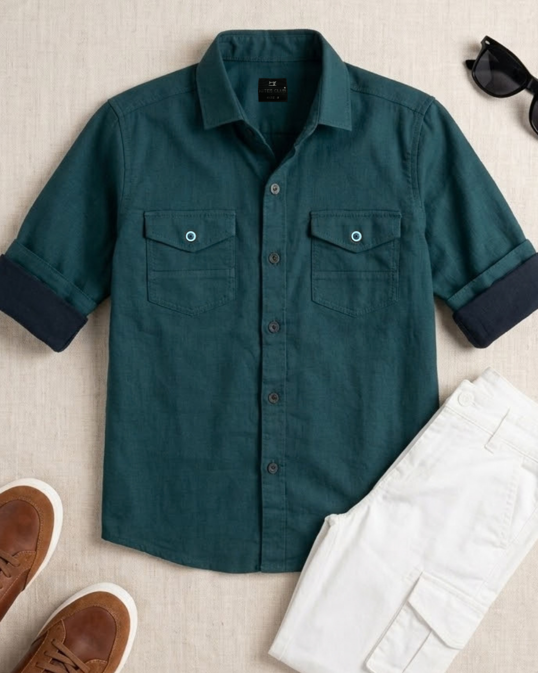 Teal cotton button-up boys shirt with short sleeves and two chest pockets