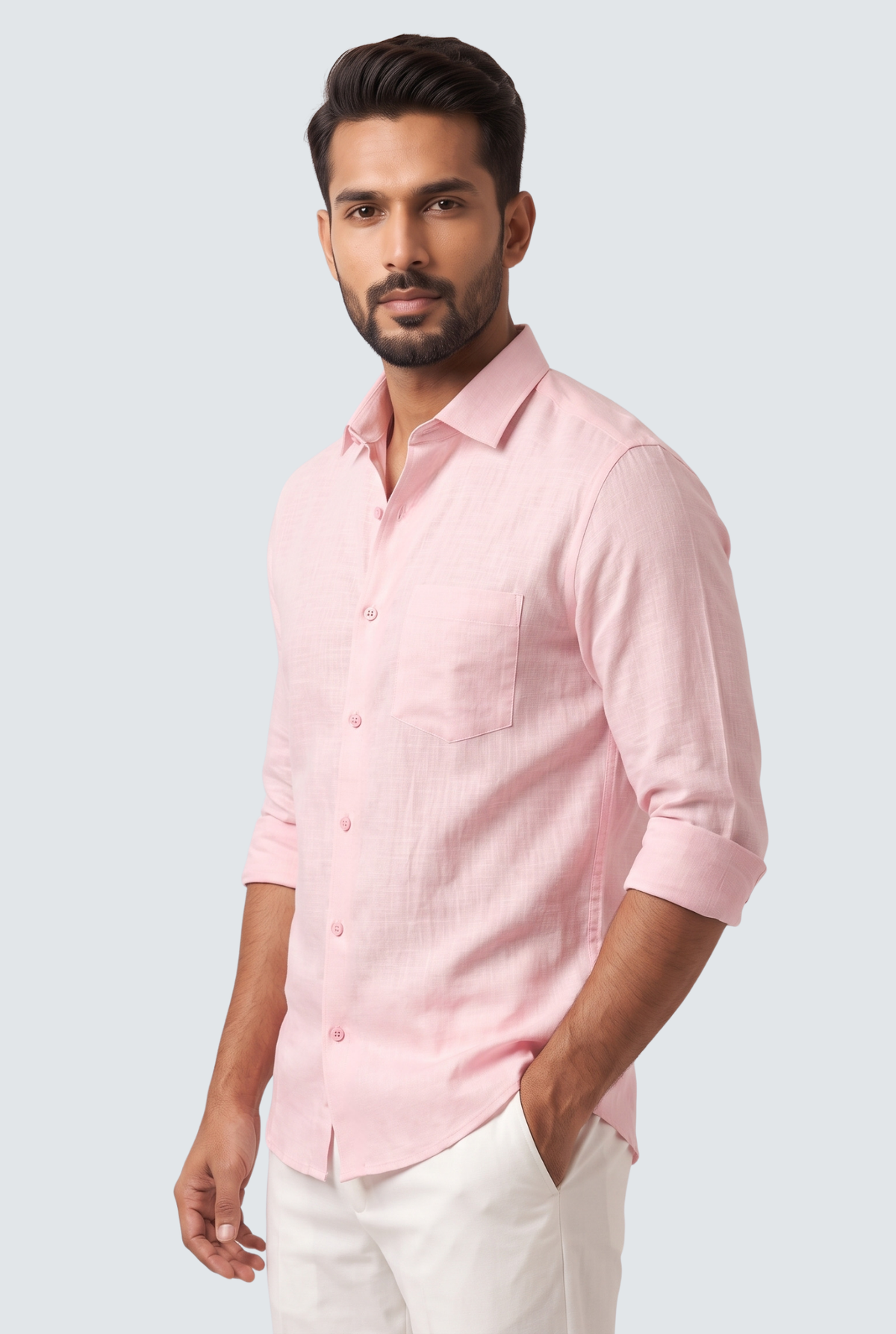 Pink linen button-down shirt with chest pocket and button placket, side view.