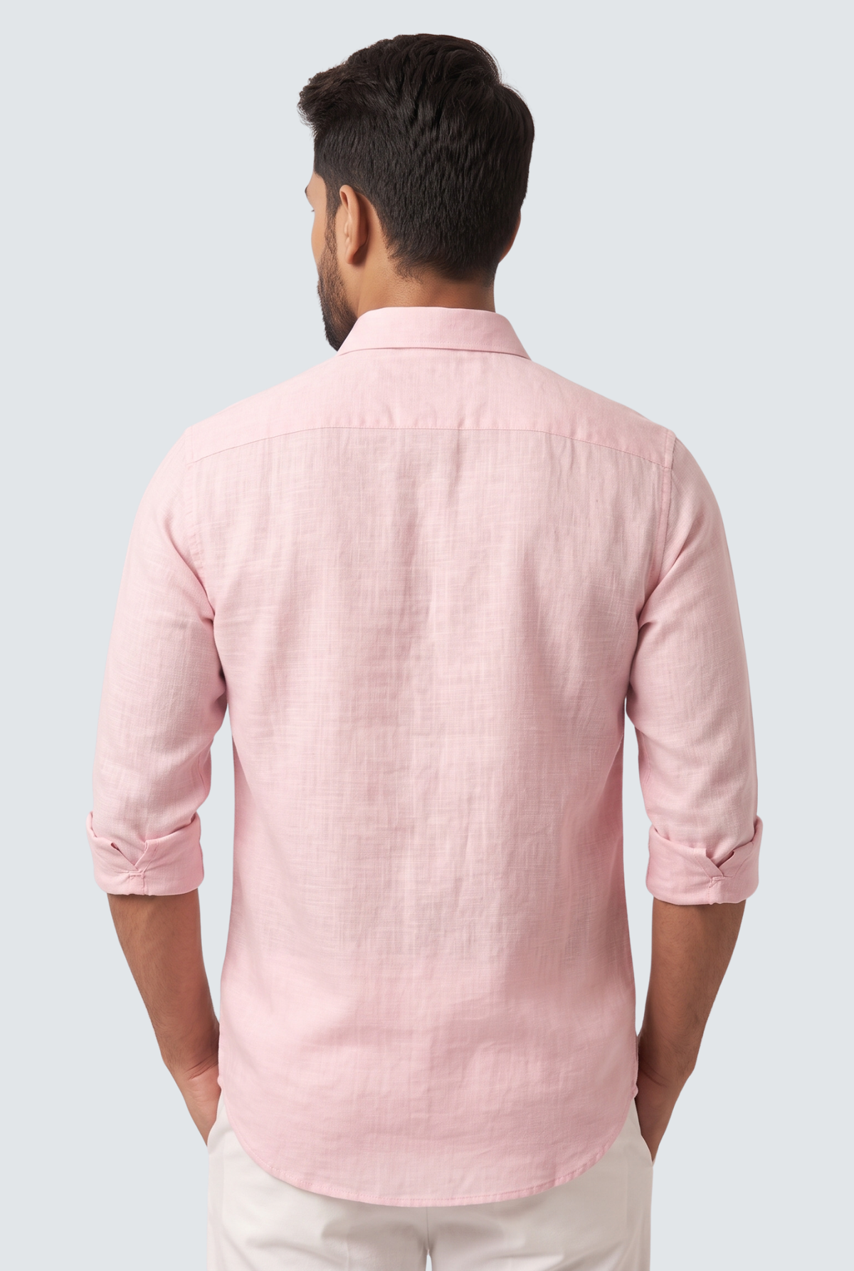Pink linen button-down shirt back view with yoke seam and full-length sleeves.