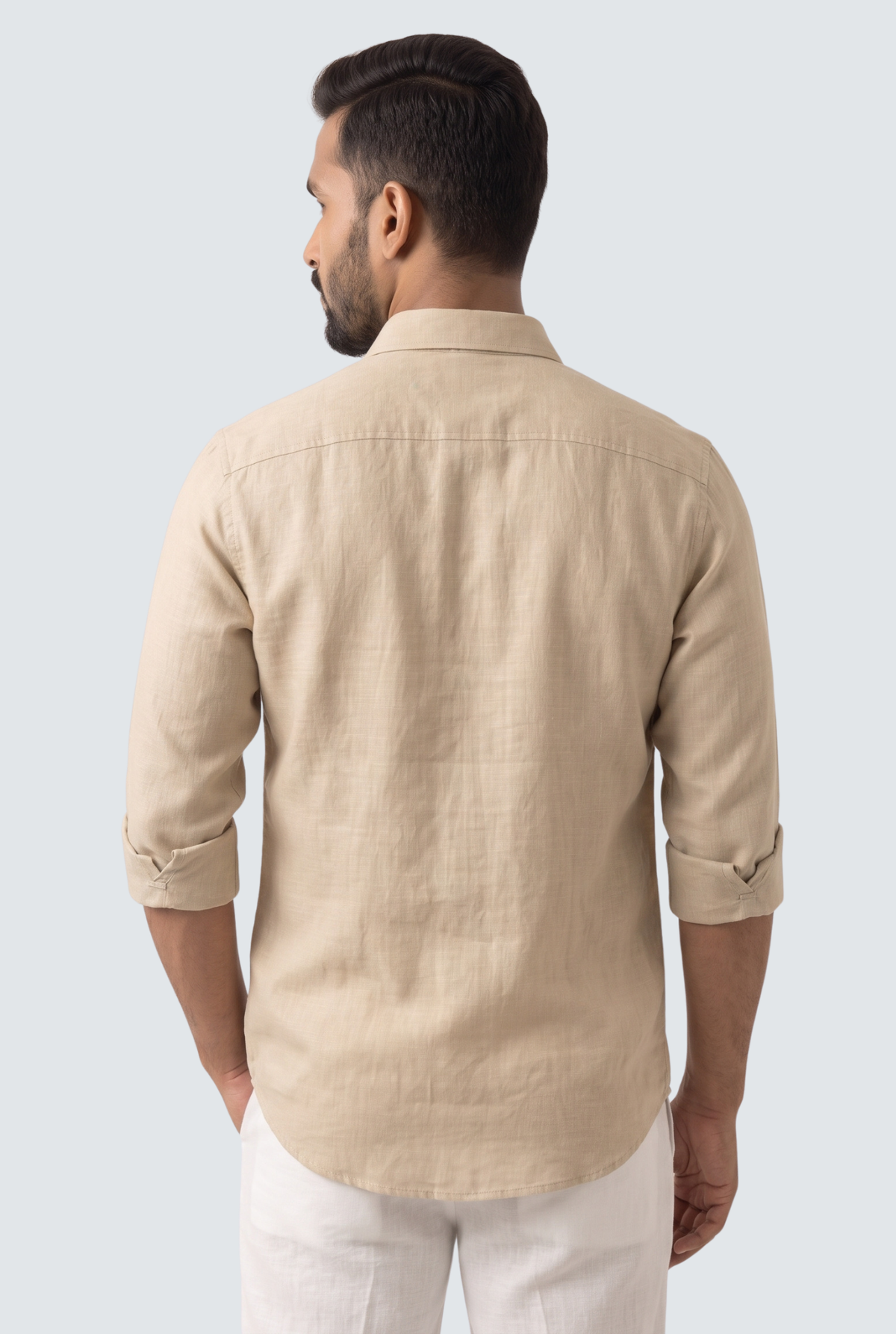 Fawn linen button-up shirt, back view with yoke and folded sleeves